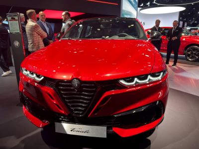 Front view with triple-segment LED headlights and signature grille