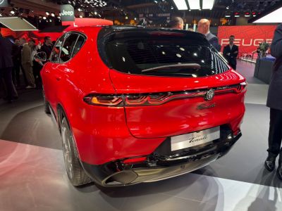 Red SUV rear with distinctive LED taillights and sporty bumper.