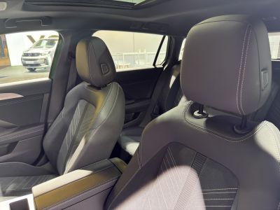 Detailed front seats with premium stitching in a modern car interior