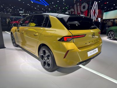 Rear and side view of a modern hatchback with sleek taillights and sporty wheels