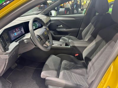 Dual digital screens and sporty front seats in a modern car interior