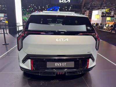 Rear view of modern electric SUV with sleek taillights and aerodynamic styling