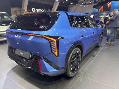 Rear view of a futuristic electric hatchback with distinctive LED lighting and aerodynamic shape