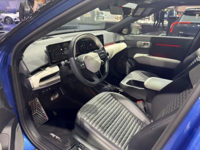 Modern electric vehicle interior with digital dashboard and quilted seats