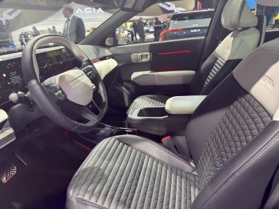 Luxury quilted seats and modern steering wheel with digital dashboard