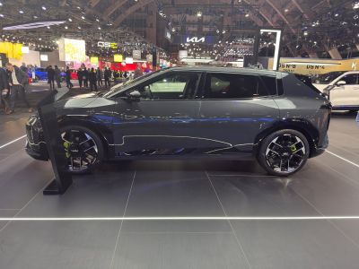 Side profile of sleek electric hatchback with futuristic wheels
