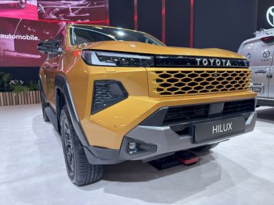 Double cab pickup front with honeycomb grille and LED headlights