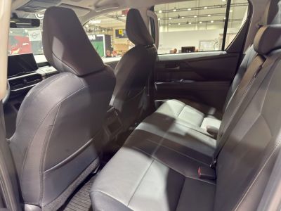 Spacious modern rear interior seating with three seats and door panel