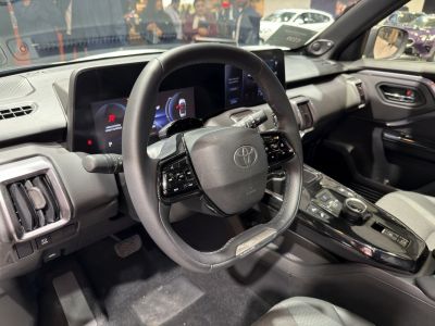Modern steering wheel and digital dashboard display in car interior