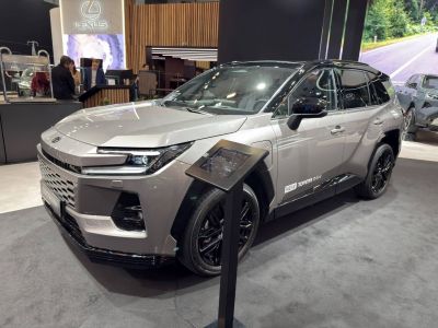 Sleek LED headlights and black alloy wheels on modern SUV front side.