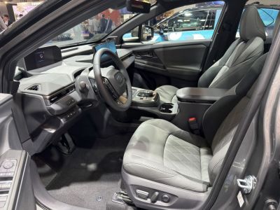 Modern car interior with digital displays and premium seats