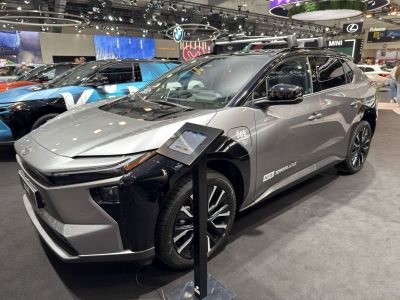 Front side of electric SUV with LED lights and black roof accents