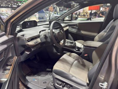 Modern electric SUV interior with digital dashboard and leather seats