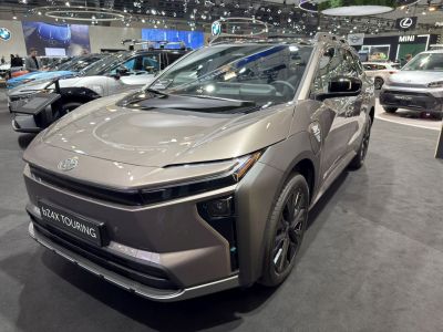 Front view of electric SUV with sleek LED headlamps.