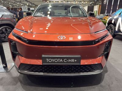 Front view with narrow headlights and bold grille design