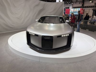 Futuristic car front with LED light bars and bold grille