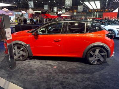 Compact hatchback side profile with black dual-tone roof and aerodynamic wheels