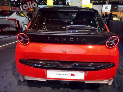 Rear view of a hatchback with round LED tail lights and black upper rear panel