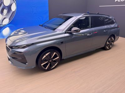 Sleek station wagon with sharp headlights and modern alloy wheels