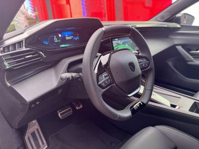 Digital dashboard and sporty GT steering wheel with detailed stitching