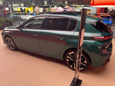 Side profile of sleek hatchback with distinct alloy wheels