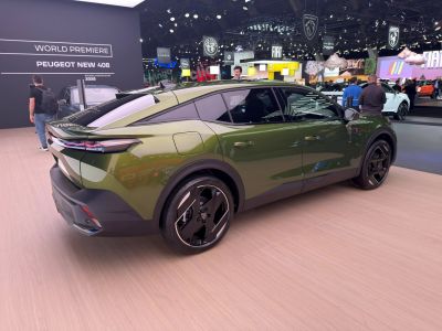 Sloping roofline rear with futuristic LED taillights and large wheels