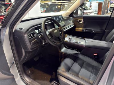 Modern car interior with digital dashboard and multifunction steering wheel