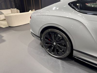 Black alloy rear wheel with fender and brake caliper detail