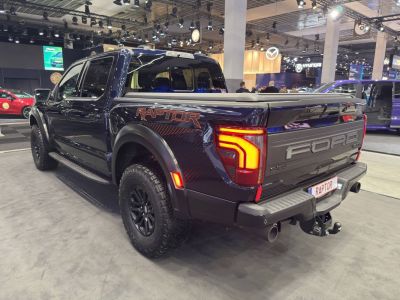 Rear view of 2024 pickup with LED taillights, rugged tailgate, off-road tires
