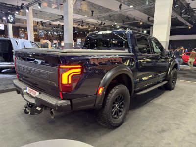 Pickup truck rear view with bold taillights and rugged tires
