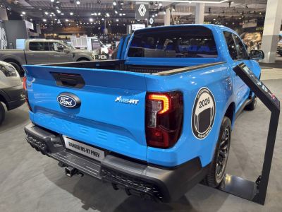 Rear view with tail lamps and MS-RT badge of blue pickup