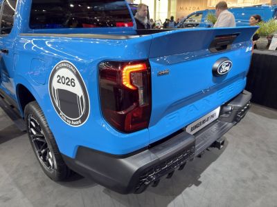Pickup rear with hybrid badge and illuminated taillights