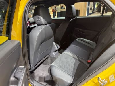 Rear seating area with leather and fabric upholstery, modern interior design