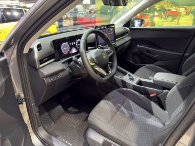 Modern car interior with dual digital displays and advanced steering controls