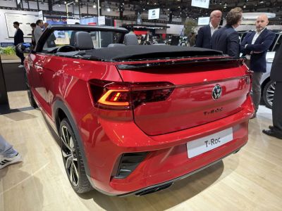 Red convertible rear with LED taillights and black fabric roof