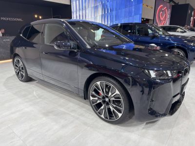 Sleek front and side profile with angular headlights and alloy wheels.