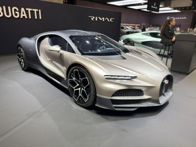 Sleek aerodynamic coupe with futuristic headlights and premium wheels