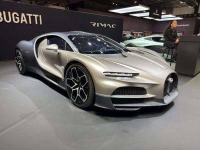 Aerodynamic front and side profile with sleek headlights and sporty wheels