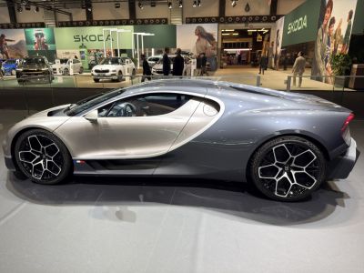 Silver two-tone sports coupe with aerodynamic shape and multi-spoke alloy wheels