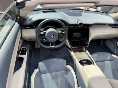 Luxury convertible cockpit with premium steering wheel and dashboard