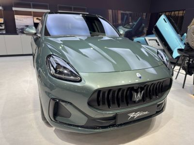 Close-up on aggressive LED headlights and vertical grille