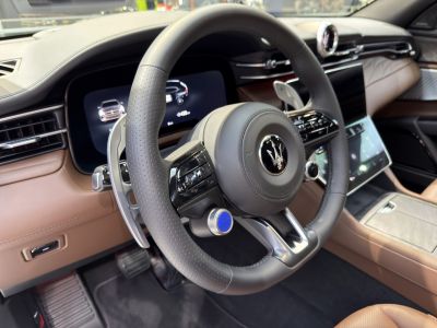 Digital instrument cluster with multi-function steering wheel and premium interior materials