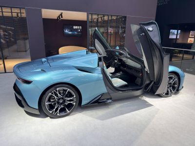 Luxury sports coupe with scissor doors and aerodynamic design.