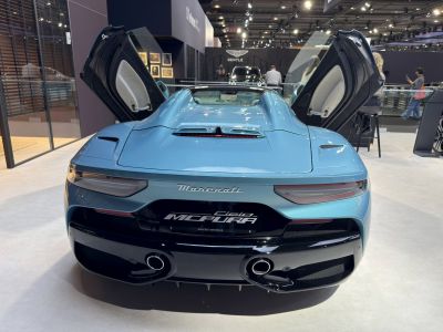 Rear view of sports car with gullwing doors open