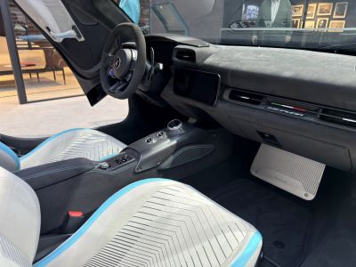 Luxury car interior with carbon fiber console and modern dashboard