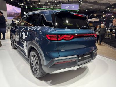 Rear view of blue SUV with LED tail lights and aerodynamic design
