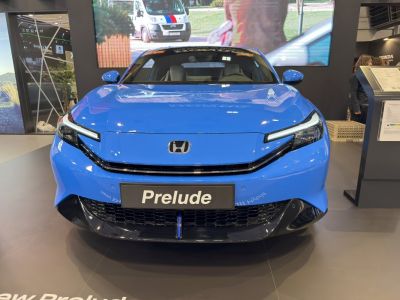 Front view with slim LED headlights and aerodynamic grille