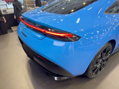 Rear LED light bar and black alloy wheel of a sporty coupe