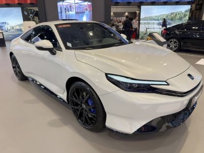 Sleek front view with LED headlights and black alloy wheels