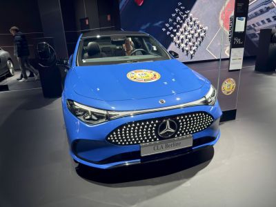 Front view with illuminated star grille and sleek headlights